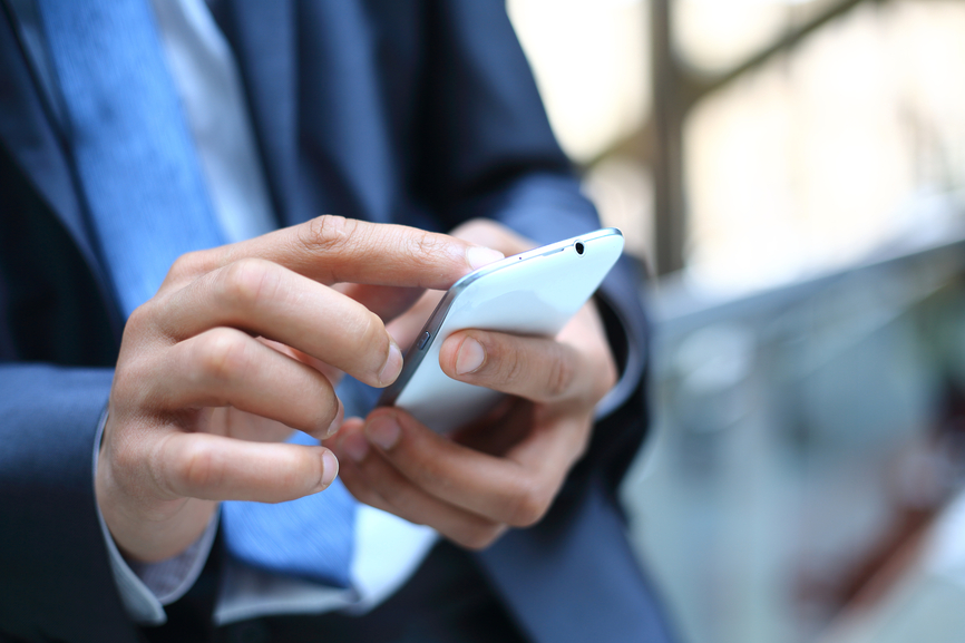 Man texting on his mobile device