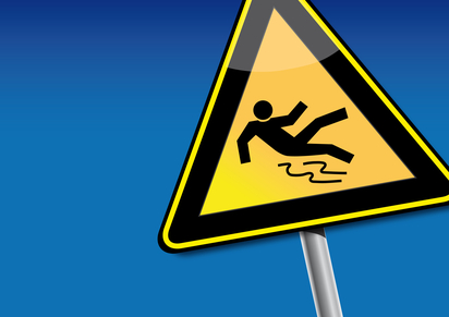sign post showing slippery area