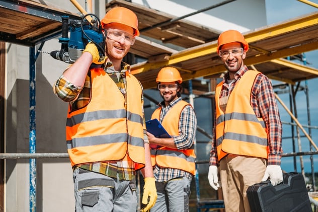 Group of builders wearing hard hats