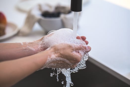 Canva - Person Washing His Hand