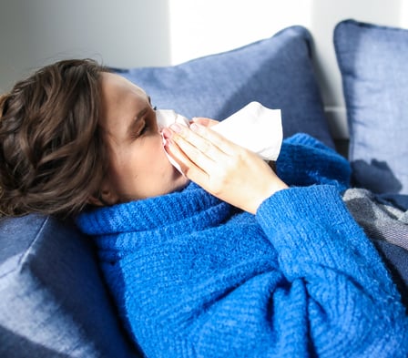 Canva - Woman in Blue Sweater Lying on Bed-1