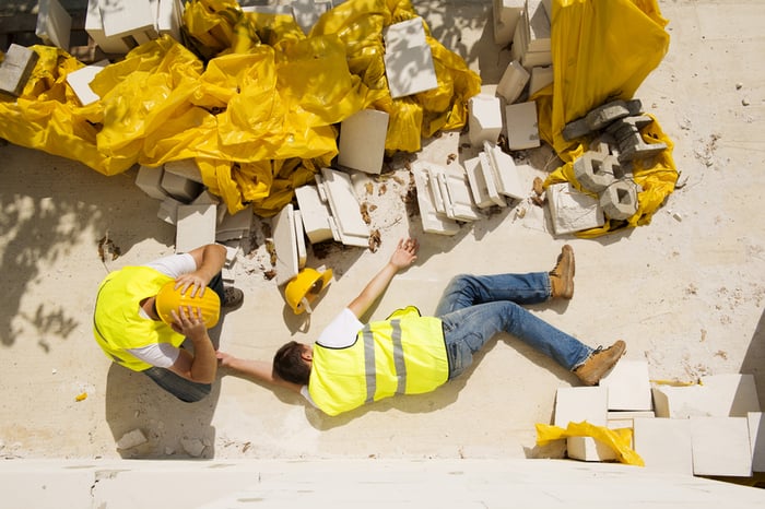 fallen construction worker on concrete