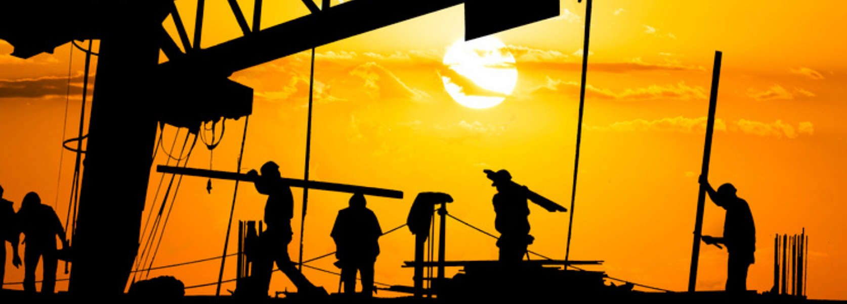 heat safety - workers on construction site in the sunshine