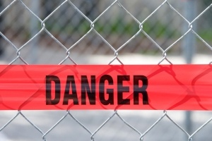 Danger sign on a wire fence